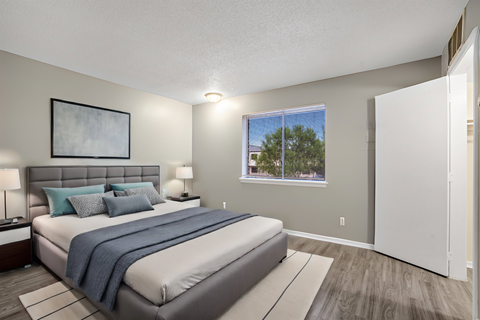 a bedroom with a bed and a window